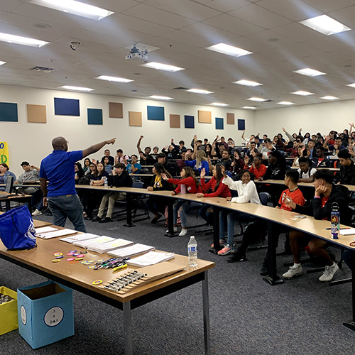 Brent Whiting leading High school students in a presentation